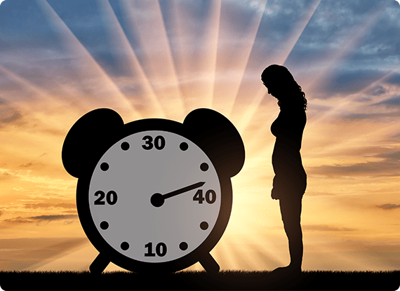 woman standing next to a clock with time ticking