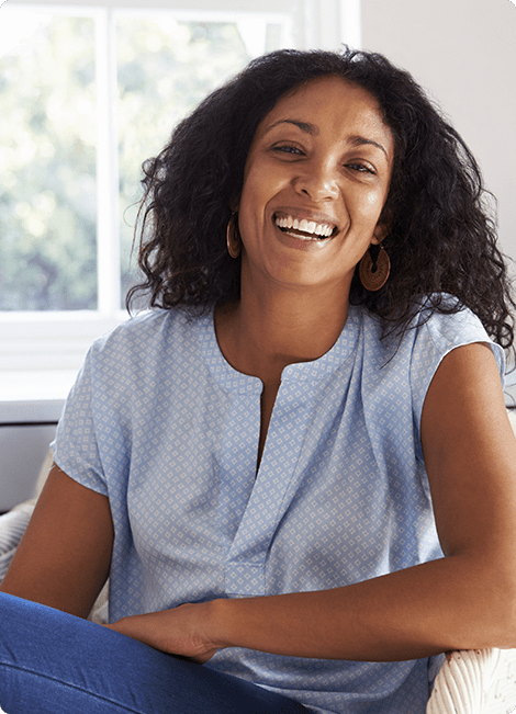 a women sitting and laughing