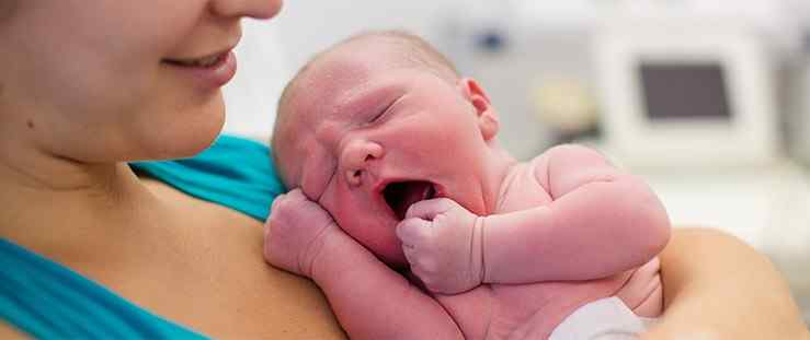 a mother given oxytocin holding her new born baby