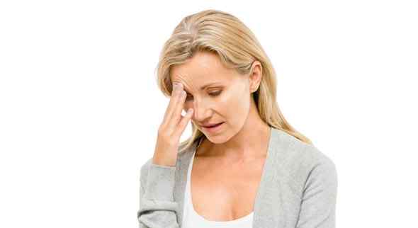 a worried middle aged women undergoing menopause